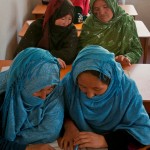 BAMYAN PROVINCE, Afghanistan - Middle-aged women study general education in a 1st grade class at the Arzu Studio Compound in Dragon Valley, west of the town of Bamyan. Women and children enrolled the program are employed as carpet weavers and receive higher-than average compensation for their work, and are required to attend literacy classes. They also have access to day care for their children, hot water to wash clothes, a kitchen, and a garden where they can grow their own vegetables and herbs. Younger children attend classes before and after weaving the rugs. (U.S. Army photo by Sgt. Ken Scar, 7th Mobile Public Affairs Detachment) - published in Bamyan Province emerges as a model for Afghanistan’s potential by rceast